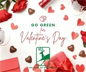 The words 'Go Green for Valentines Day" over a backdrop of red roses and heart-shaped chocolates