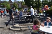 Photo of people eating and waiting in line at Food Truck Wednesday
