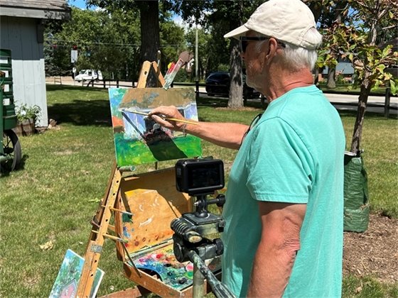 Man painting at the Historic Village