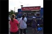 People waiting in line at a food truck