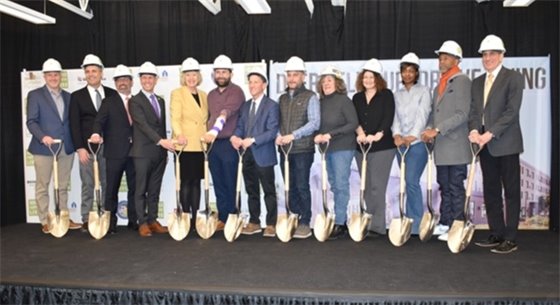 Photo of officials holding shovels at the groundbreaking