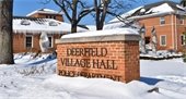 Masonry Village Hall sign in the snow